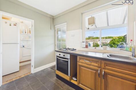 Kitchen with attached Utility and Conservatory