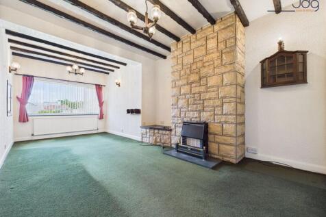 Second sitting room with a stone-clad chimney breast