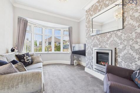 Lounge with bay window and a modern feature fireplace