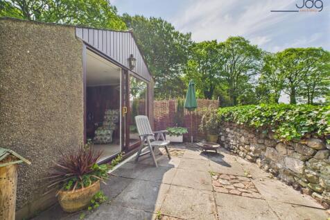 Converted Garage with sliding doors and seating area