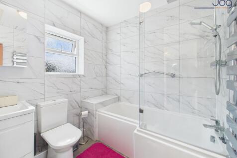 A contemporary bathroom with a rainfall shower