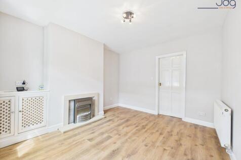 Lounge with wood-effect flooring and electric fire