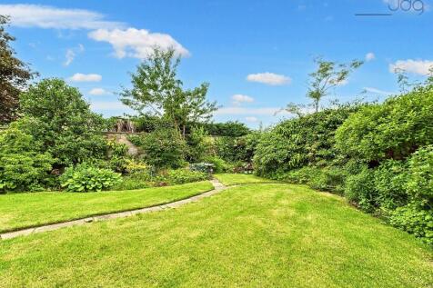 Garden with patio seating area