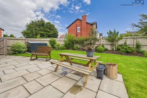 Lawn and Flagged Seating Area ¿ Neat, Practical &amp; Inviting