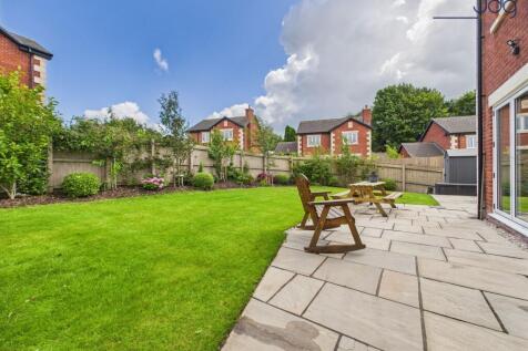 Lawn and Flagged Seating Area