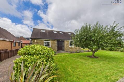 Front of the property with established apple tree and driveway