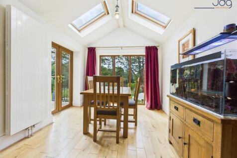 Extended Snug with Dining Room and views