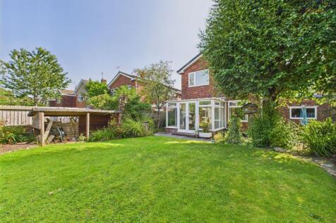 Mature garden with a mix of flags and lawn