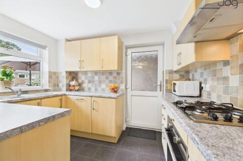 Open Plan Kitchen Diner with access to the Sun Room and the back Garden