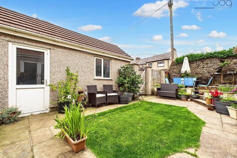 South West Garden with Garage entrance
