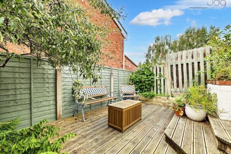 Tiered Garden with plenty of seating areas, flagged, decked and mixed lawn.