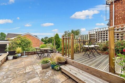 Tiered Garden with plenty of seating areas, flagged, decked and mixed lawn.