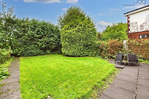 Spacious Green Garden with mix lawn and flags