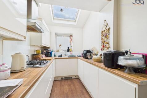 Galley-Style Kitchen with sky light