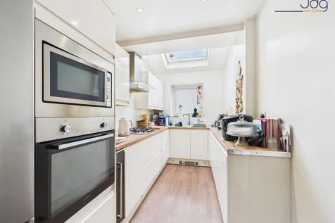 Galley-Style Kitchen with sky light