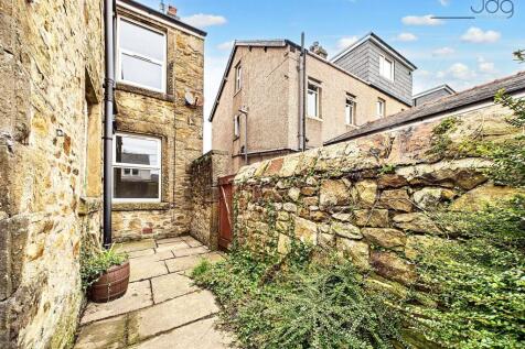 South West Facing Yard with access to the garage and storage