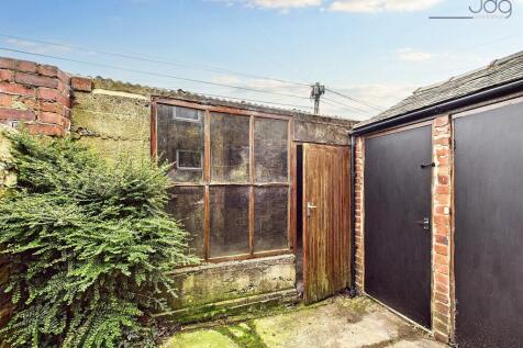 South West Facing Yard with access to the garage and storage