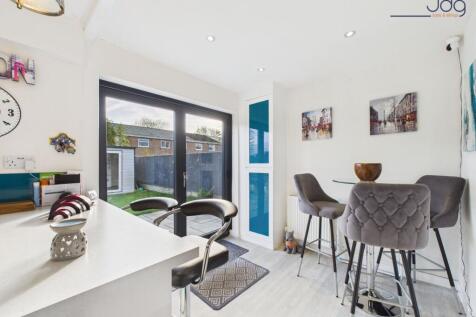 Open Plan Kitchen Diner with Breakfast Bar and bi-folding doors