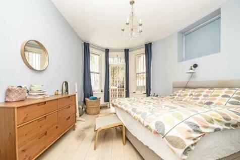 French doors to garden from double bedroom