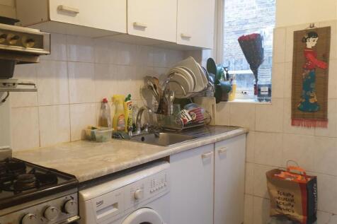 Shared kitchen with two other rooms door leading o