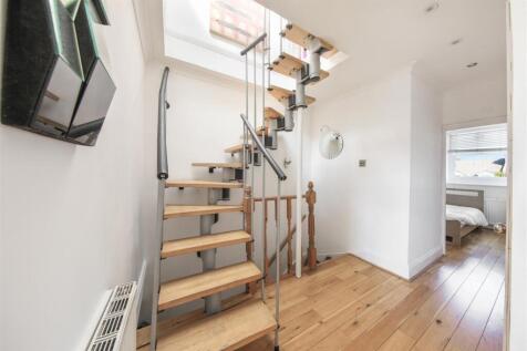 Entrance hall and spiral staircase to loft room