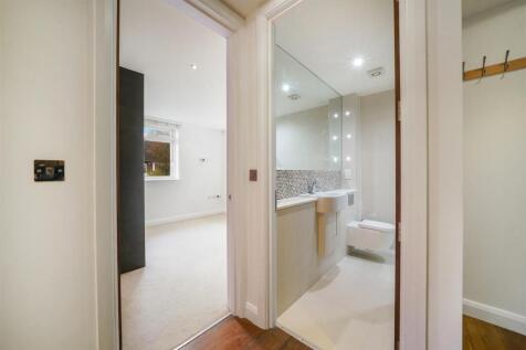 Sandstone tiled family bathroom