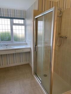 Cubicle shower within bathroom