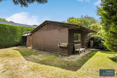 Former single stable, a covered caravan storage ar
