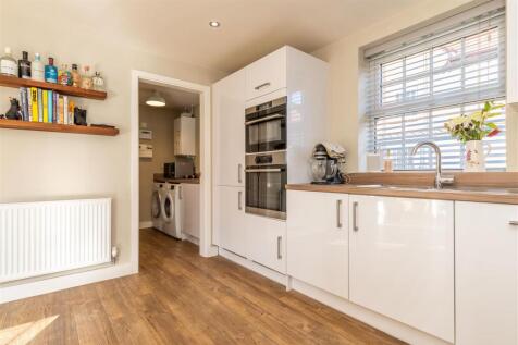 Kitchen through to Utility