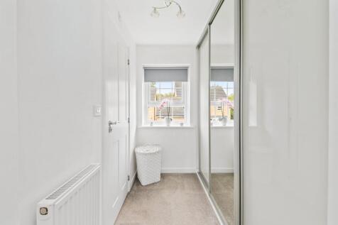 BEDROOM ONE WALK-IN WARDROBE