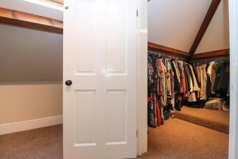 Walk in wardrobe to Bedroom 2