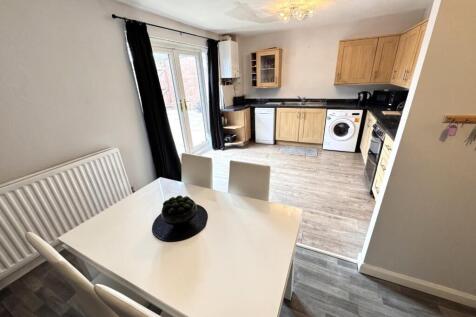 DINING AREA INTO THE KITCHEN