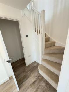 STAIRS TO THE FIRST FLOOR AND STORAGE