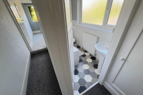 ACCESS TO BEDROOM THREE AND BATHROOM