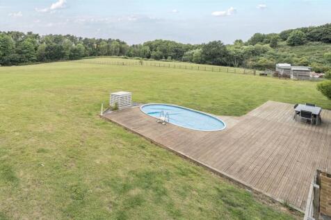 Swimming pool &amp; decking to rear