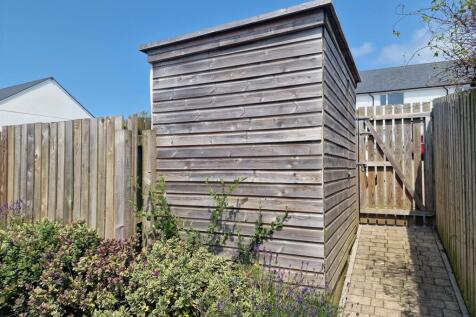 Parking path and shed.