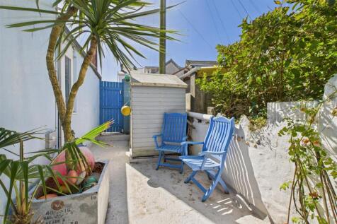 Rear courtyard garden and storage