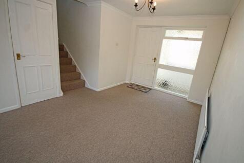 sitting room with stairs to first floor