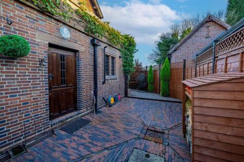 Right side elevation with historical plaque above 