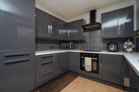 Spacious, Modern Kitchen with Sleek Cabinetry