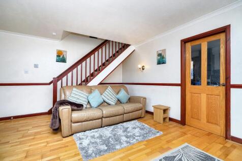 Living Room with Door Leading to Kitcheb