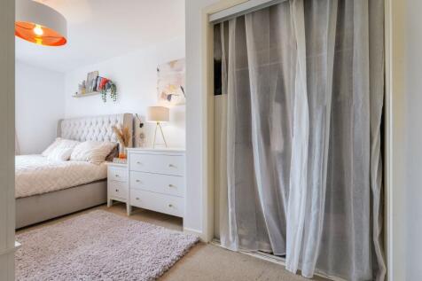 Deep wardrobe and view of super king sleeping area