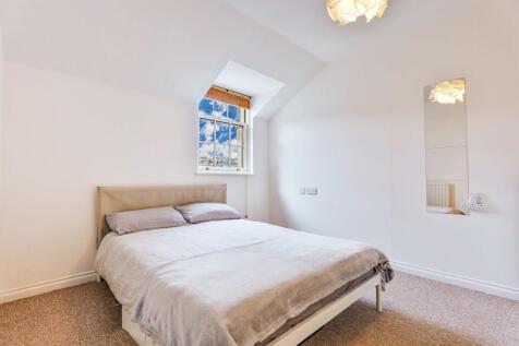 Generously-proportioned doubled bedroom. View to rear of property