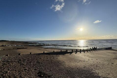THE BEACH AT THE BOTTOM OF SEA LANE