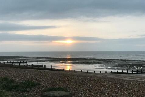 THE BEACH AT THE BOTTOM OF SEA LANE