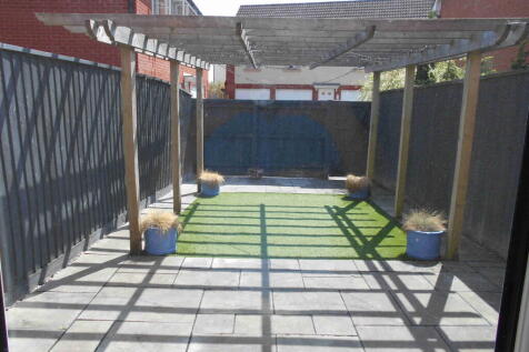 Garden leading to Garage