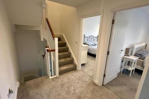 The staircase continues from the first floor to th