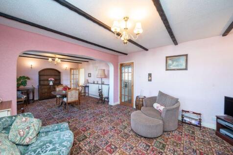 LOUNGE OPENS TO DINING ROOM