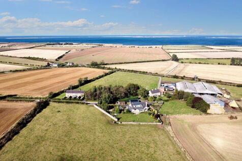 Plot with distant views of Lindisfarn...