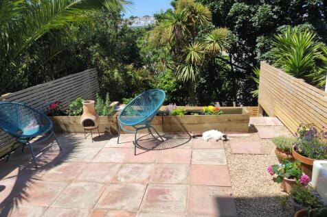 Patio garden leading to the grass garden below
